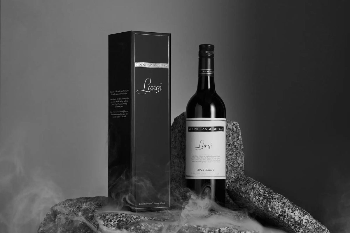 Mount Langi Ghiran Langi Shiraz bottle and gift box displayed among smoky rocks